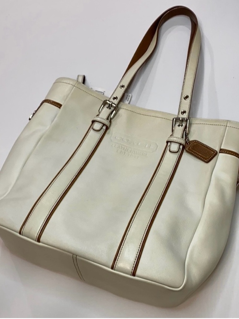 Coach White Leather Messenger Tote with Brown Trim

From a smoke-free home.